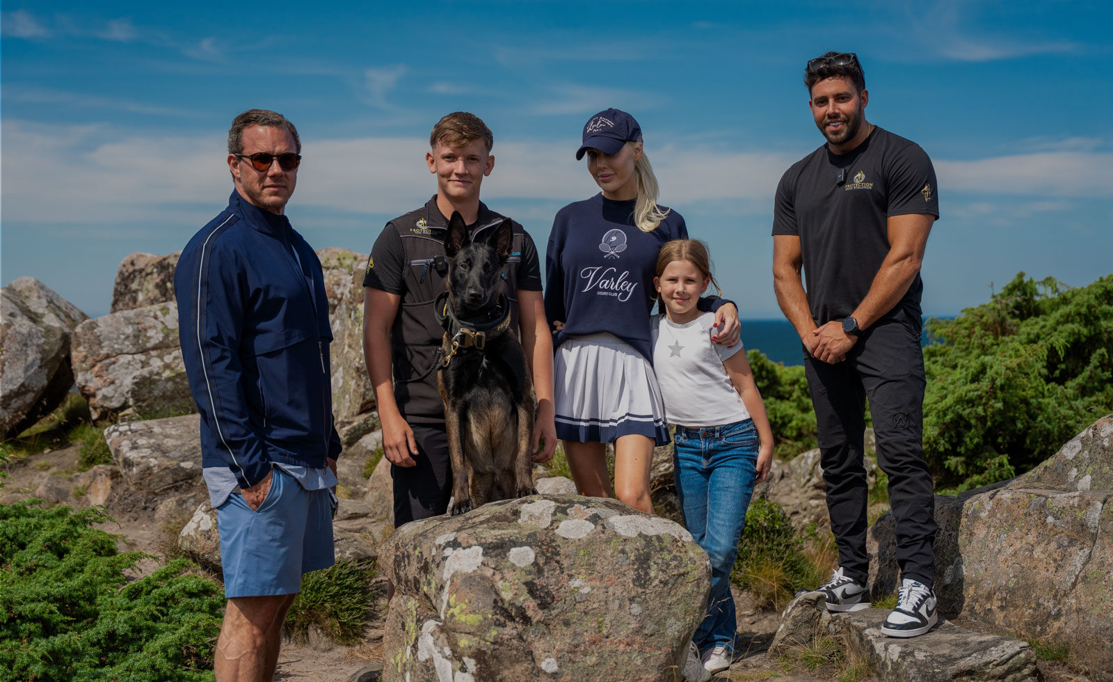 A belgium malinois sat with there new owners. Provided by Protection Dogs Worldwide, the leaders in protection dogs for high net worth individuals